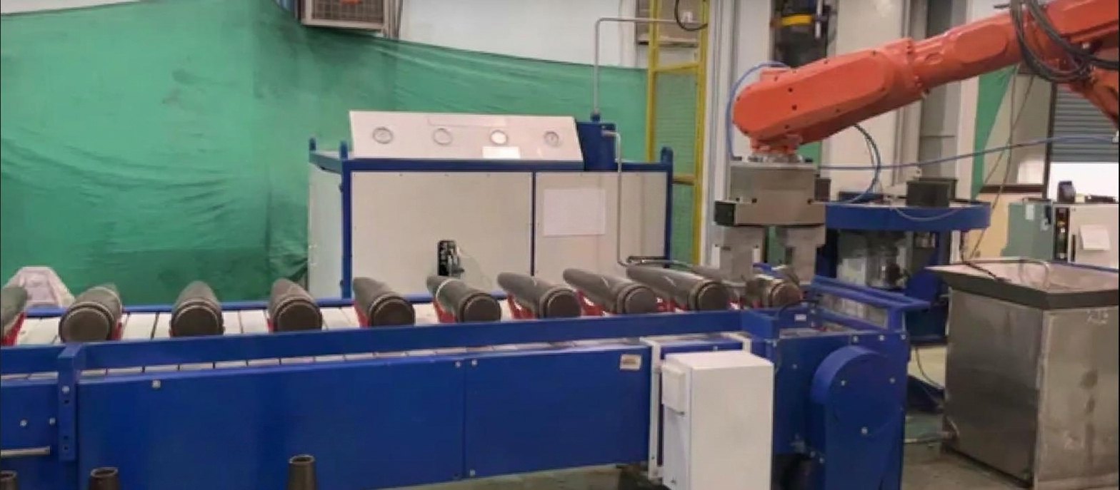 Neometrix robot-served 155 mm base-bleed shell finishing line