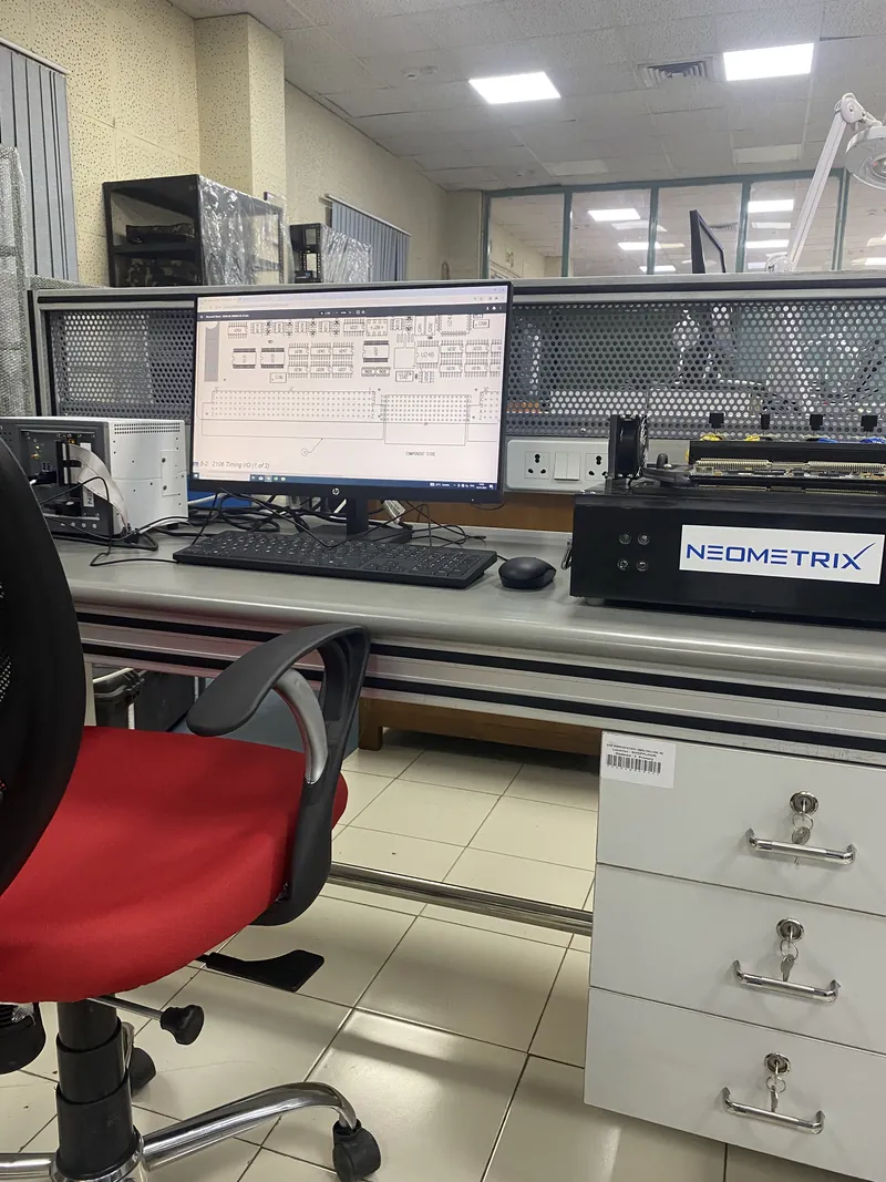 Neometrix PCB Thermal Test Bench — thermal imaging workstation with control unit, PCB test fixture, and layout-analysis monitor on the shop floor