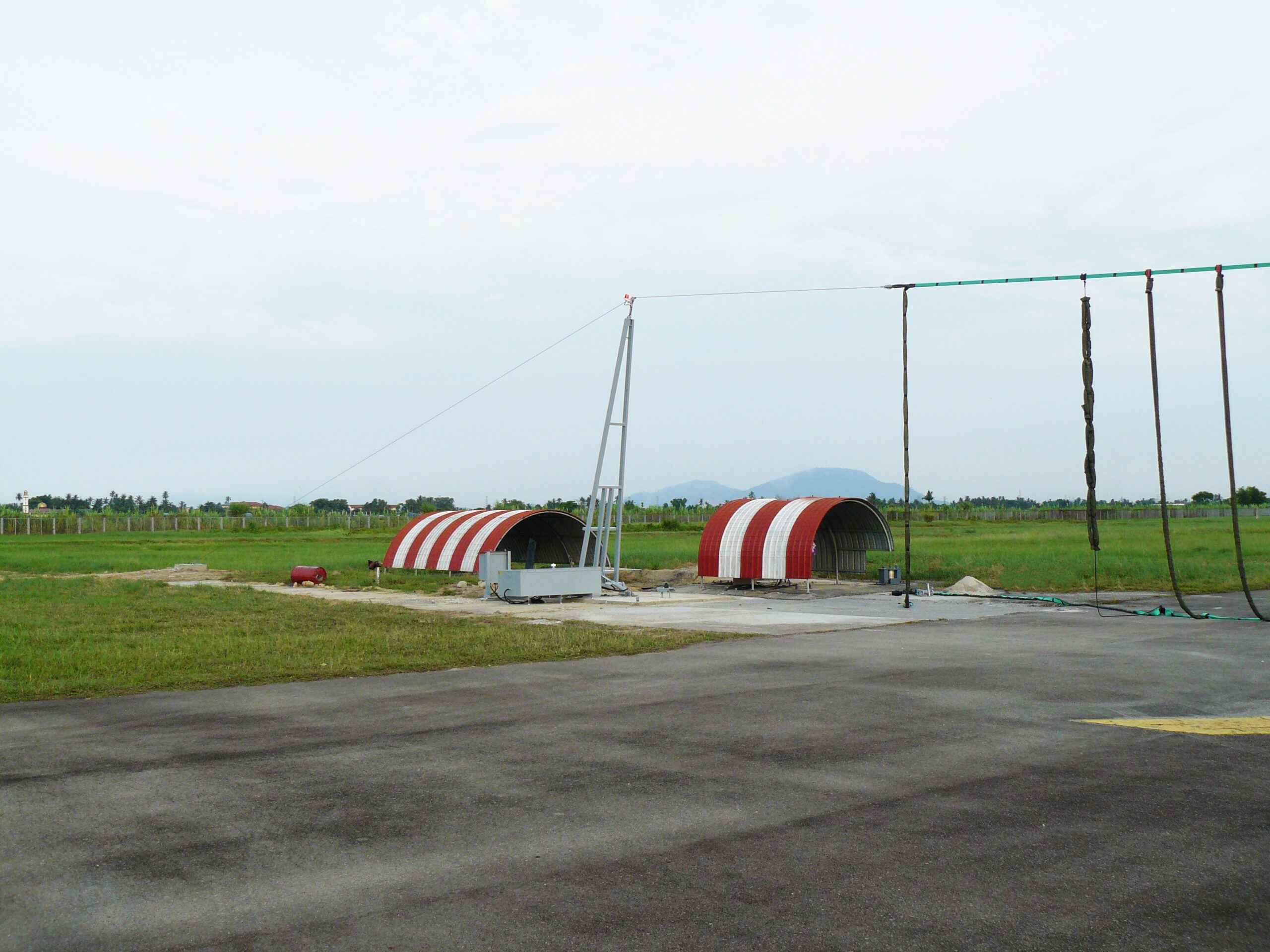 Aircraft arrester barrier system deployed configuration - runway emergency barrier net and energy absorber for airforce aircraft stopping by Neometrix