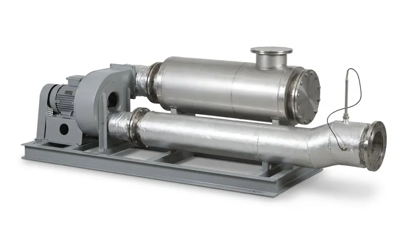 A single electric hot air generator on a plain white studio background: a low welded grey steel skid frame carrying a grey centrifugal blower with a smooth grey electric motor and guarded drive, a long horizontal cylindrical heater vessel wrapped in bright silver insulation cladding with a bolted round flange cover and a round steel terminal box on top, a thick silver insulated outlet duct ending in a bolted flange, and a slim metal-sheathed temperature probe with a thin black lead entering the duct, and no people