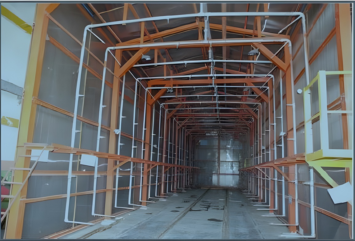 Water leak testing system interior view - orange structural steel test tunnel with overhead spray pipe network and rail track for railway coach watertightness validation by Neometrix